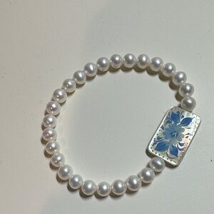 Elegant Pearl Bracelet with Blue Floral Accent
